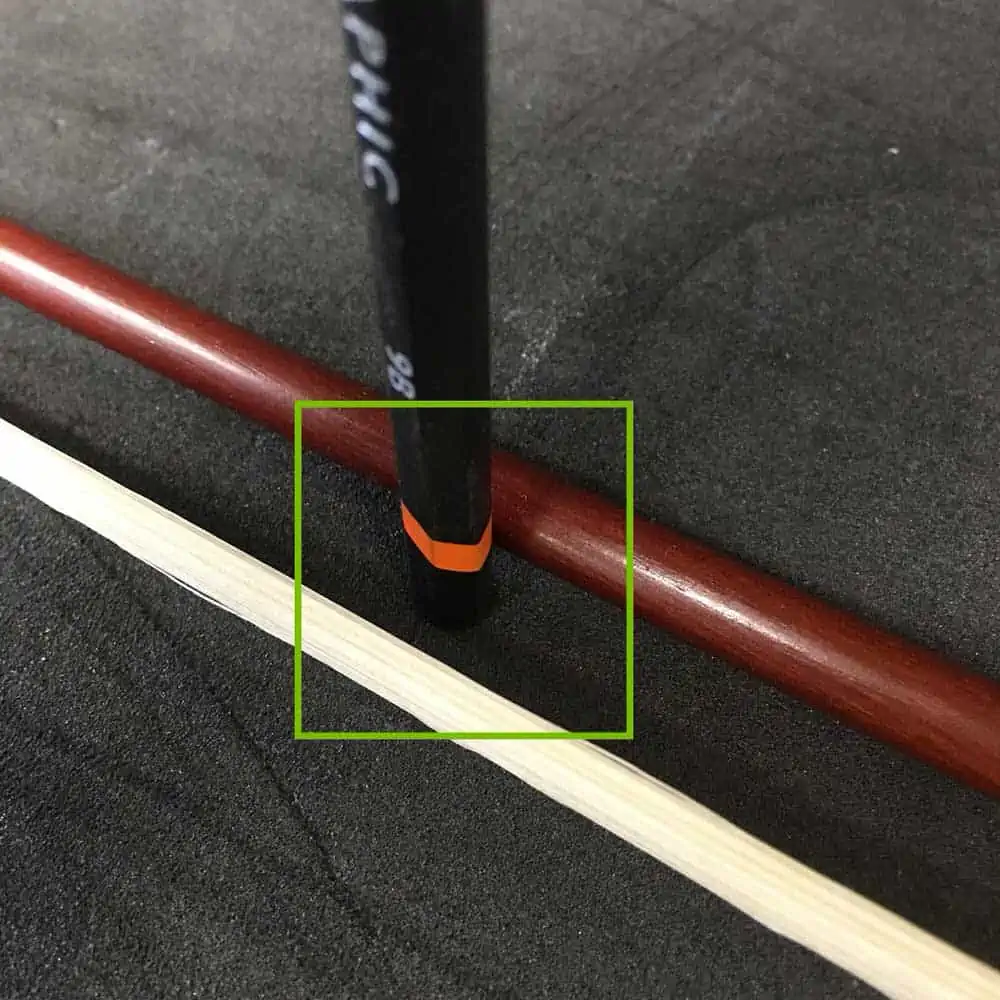 Pencil in violin bow