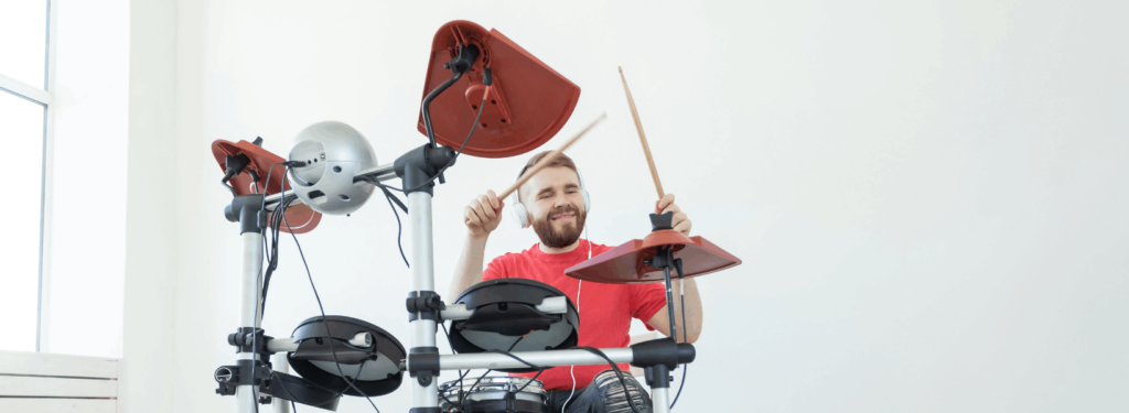 Man Playing An Electronic Drum Set