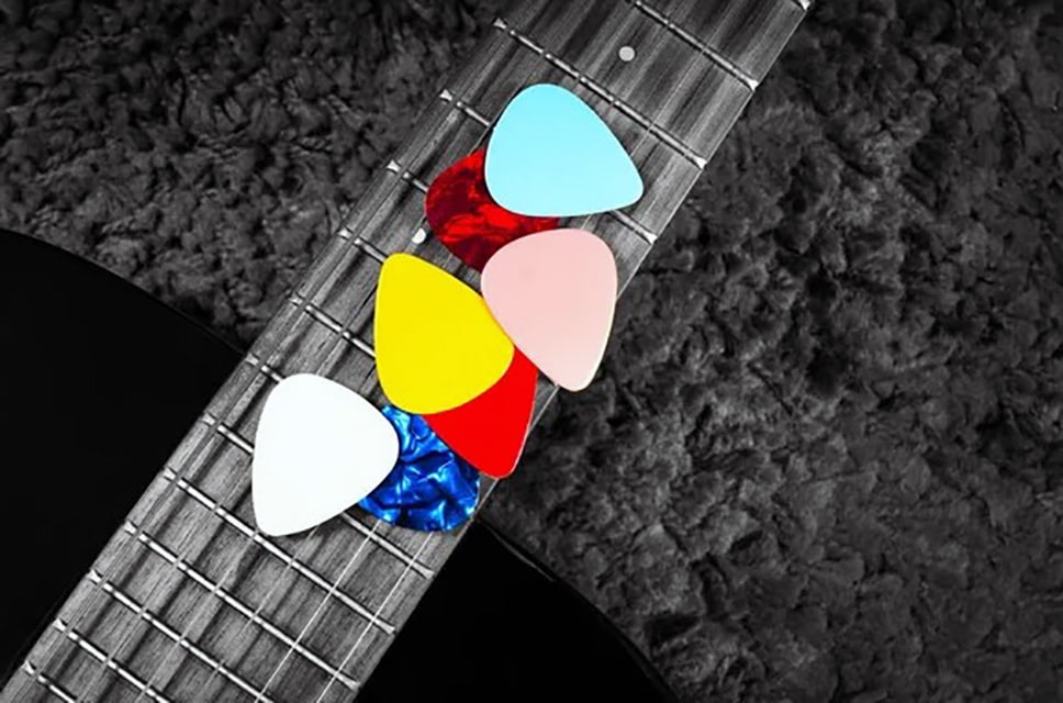 Gift For Guitarist: Perfect Picks They'Ll Love Picks On Guitar Fingerboard