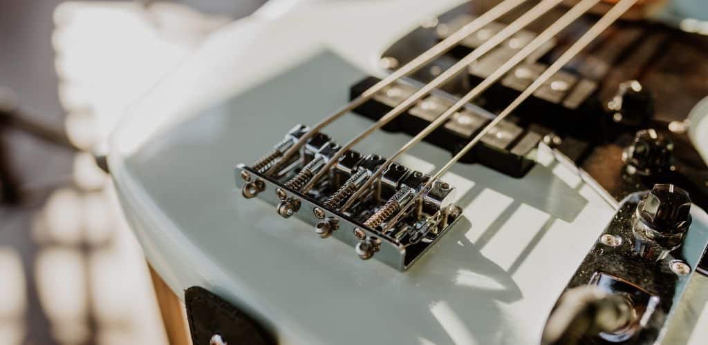 Ibanez Ergodyne Bass Guitar A White 5-String Bass Guitar Focused On The The Strings
