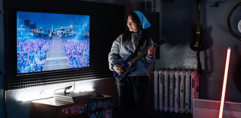Smallest Instrument In The World A Girl Learning To Play The Instrument Through Playing An Interactive Game