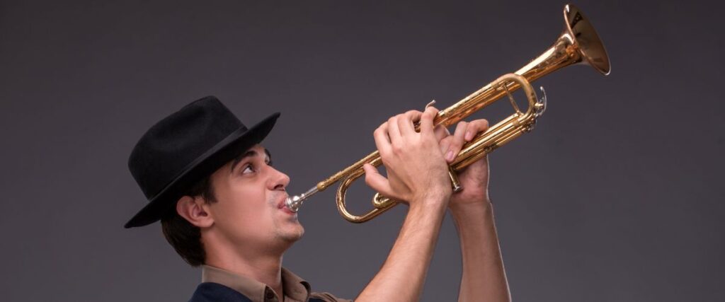 From Wall Street To Jazz Stages: The Journey Of Jonathan Dely A Jazz Trumpet Player Playing A Jazz Using A Gold Trumpet
