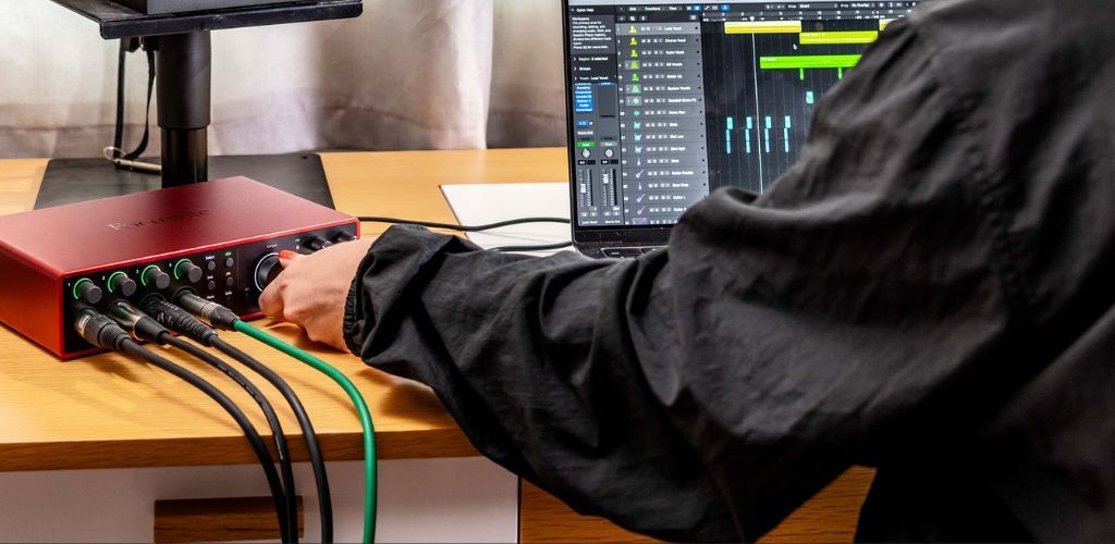 A Product Image Of A Focusrite Scarlett Being Used In A Home Studio