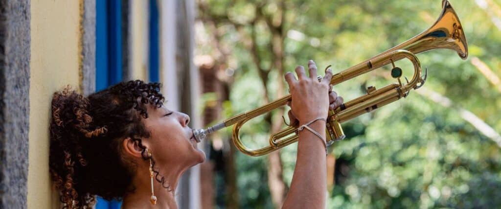 Trumpet In The Wild: 6 Epic Stories Of Trumpeters Playing In The Strangest Places! A Woman Happily Playing The Trumpet