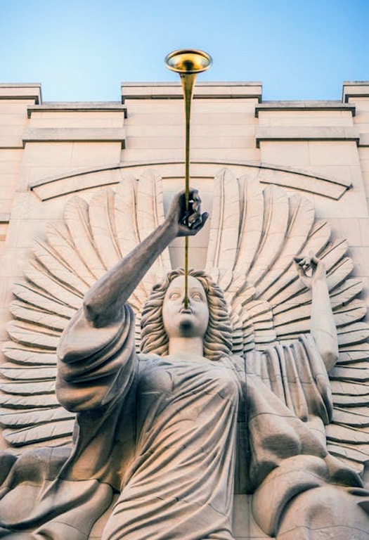 Gideon’s Trumpet: A Case That Changed Legal History Man Holding Trumpet Statue