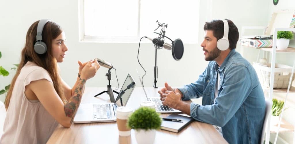 Podcast Kit: Unlock Your Audio Potential Today Two People Recording A Podcast Using A Podcast Kit
