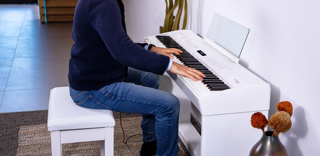 Roland Fp60X: Unlock Your Ultimate Piano Performance A Roland Product Image Of A Roland Fp60X Being Played By A Professional Pianist