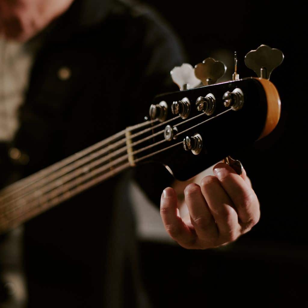 Ibanez Ergodyne Bass Guitar A Bass Guitarist Tuning His 5-String Bass Guitar