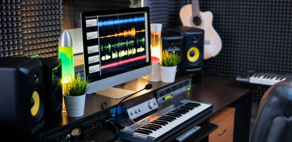 A Mac Inside A Recording Studio Showing Its Compatibility With The Audio Interface And Daw