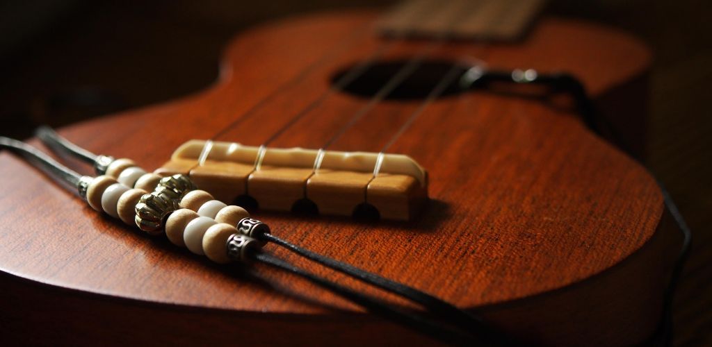 How To Put A Ukulele Strap On: Master Your Music Setup Effortlessly A Ukulele With A Beaded Strap