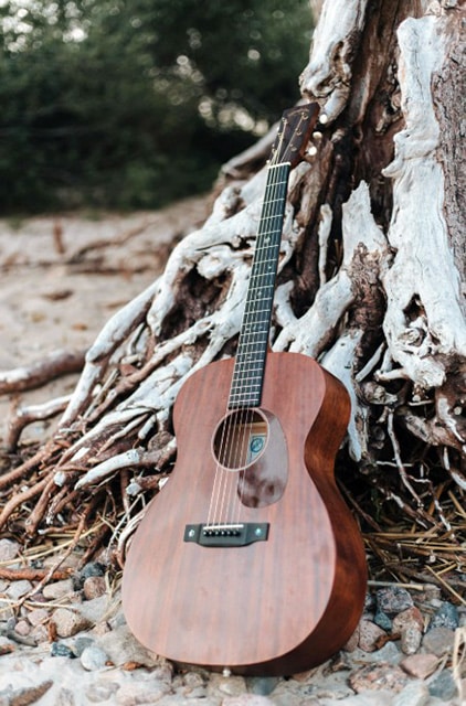 Best Acoustic Guitar For Gigging: Top Picks For Unforgettable Performances Guitar Left By The Tree On The Beach