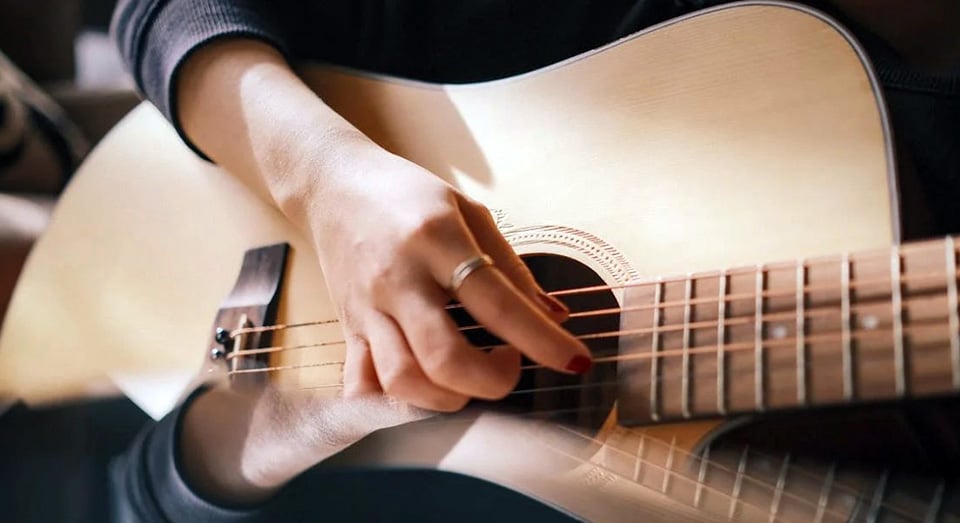 Woman Hand Playing Guitar