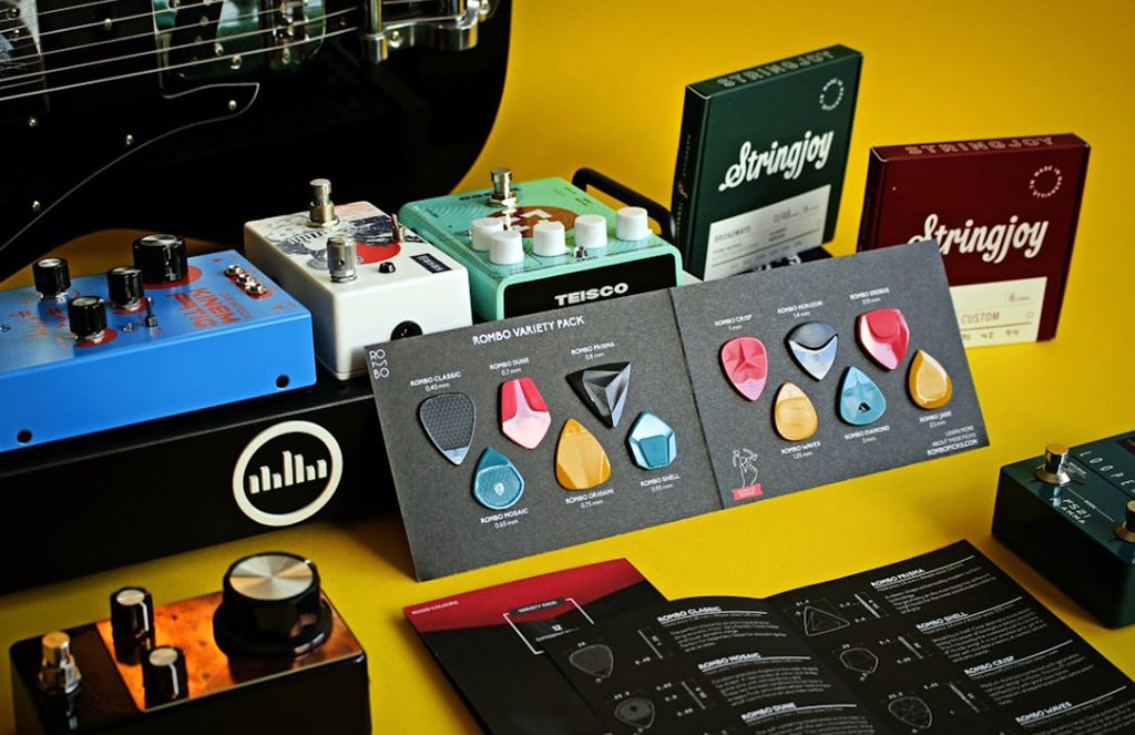 Pack Of Guitar Picks Among Filter Pedals