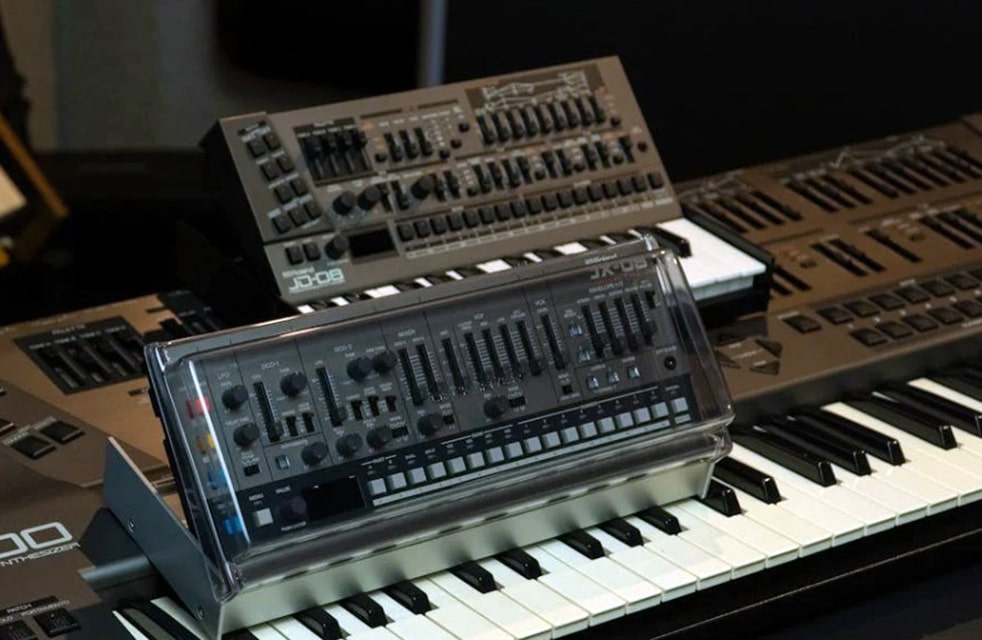Roland Synthesizer On Piano Keys