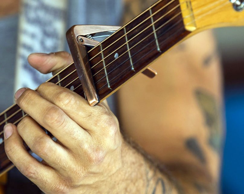 A Guitar With A Capo