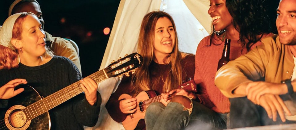 Friends Singing while Having a Bonfire