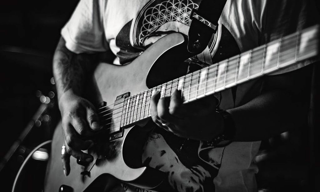 Best Beginner Rock Guitar: Top Picks, Buying Tips &Amp; Rock-Ready Advice Person Playing Electric Guitar