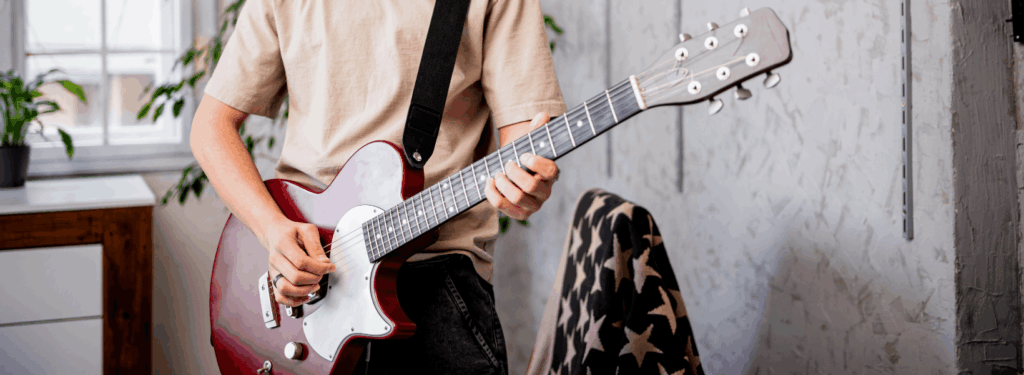 Man Playing An Electric Guitar