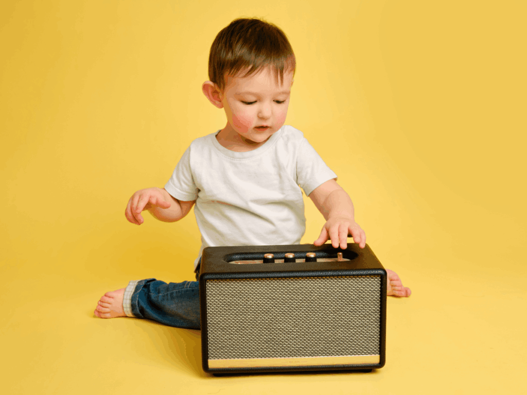 Kid Plays A Wireless Speaker