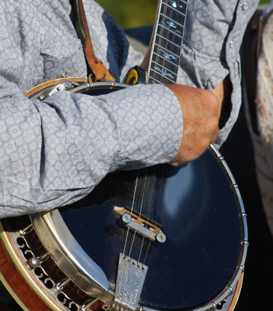 A Banjo Player Playing A Dark Blue Banjo A Banjo Player Playing A Dark Blue Banjo