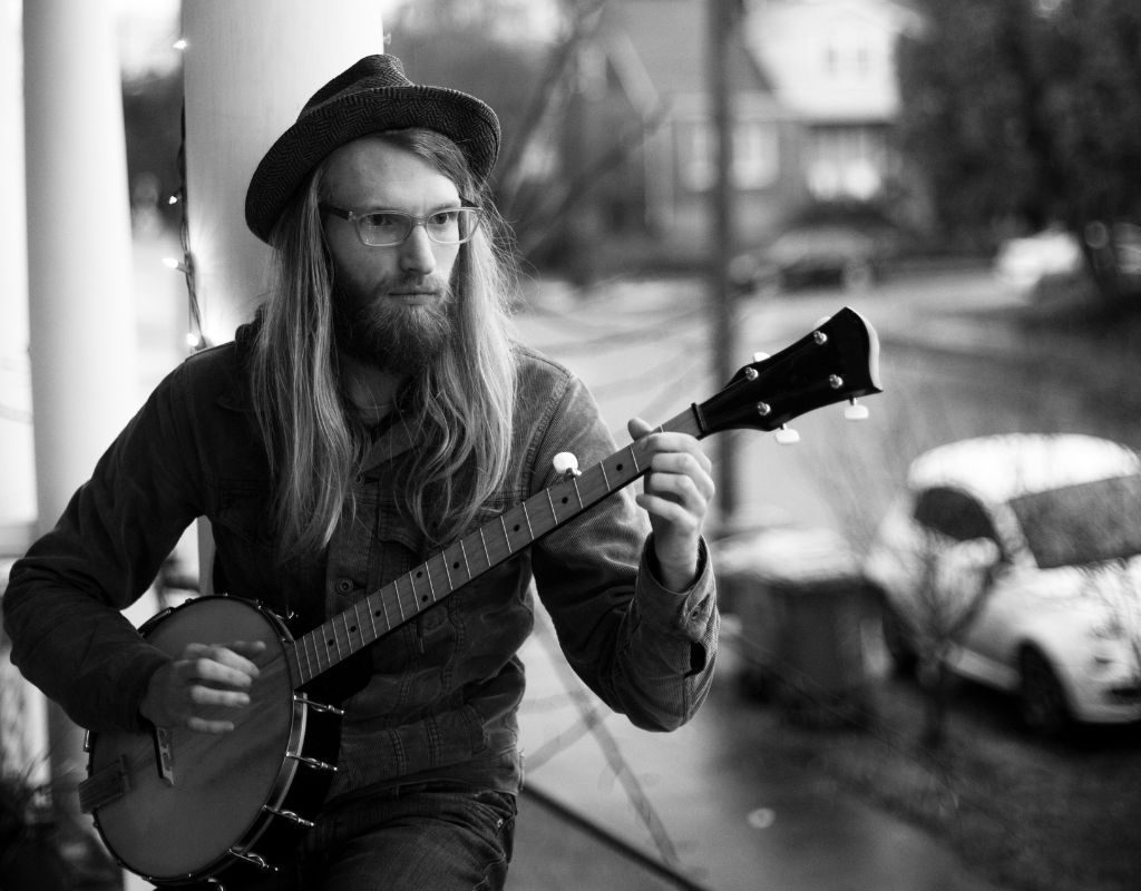 A Black And White Photo Of A Banjo Player Practicing On The Porch A Black And White Photo Of A Banjo Player Practicing On The Porch