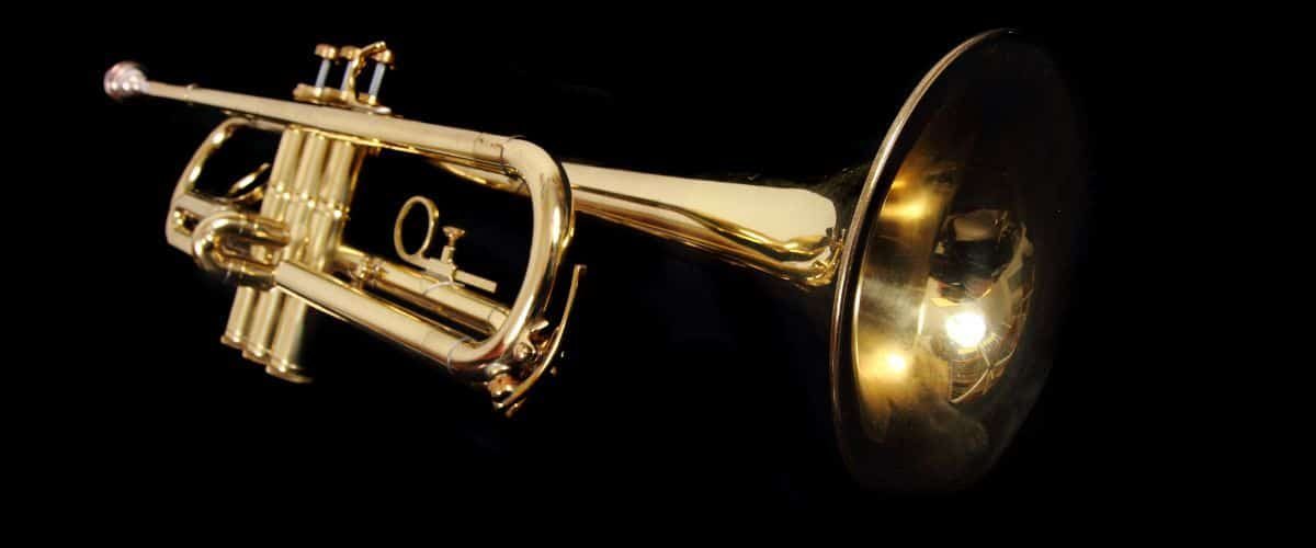 A Gold Trumpet On A Black Background A Gold Trumpet On A Black Background